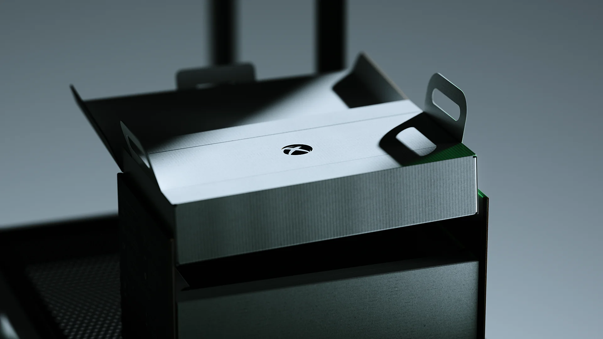 Open XBOX packaging tray with large multi-function loops for easy lifting, accessible packaging design