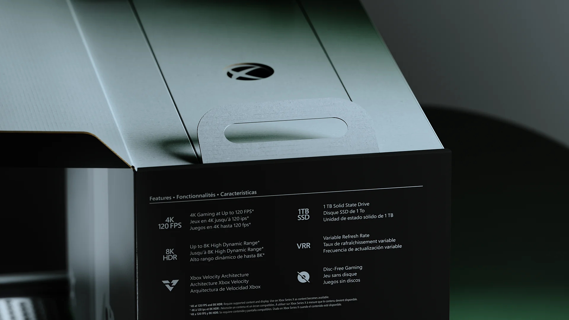 Opened XBOX Series X box with a large loop on the inner lid and the printed feature list on the side