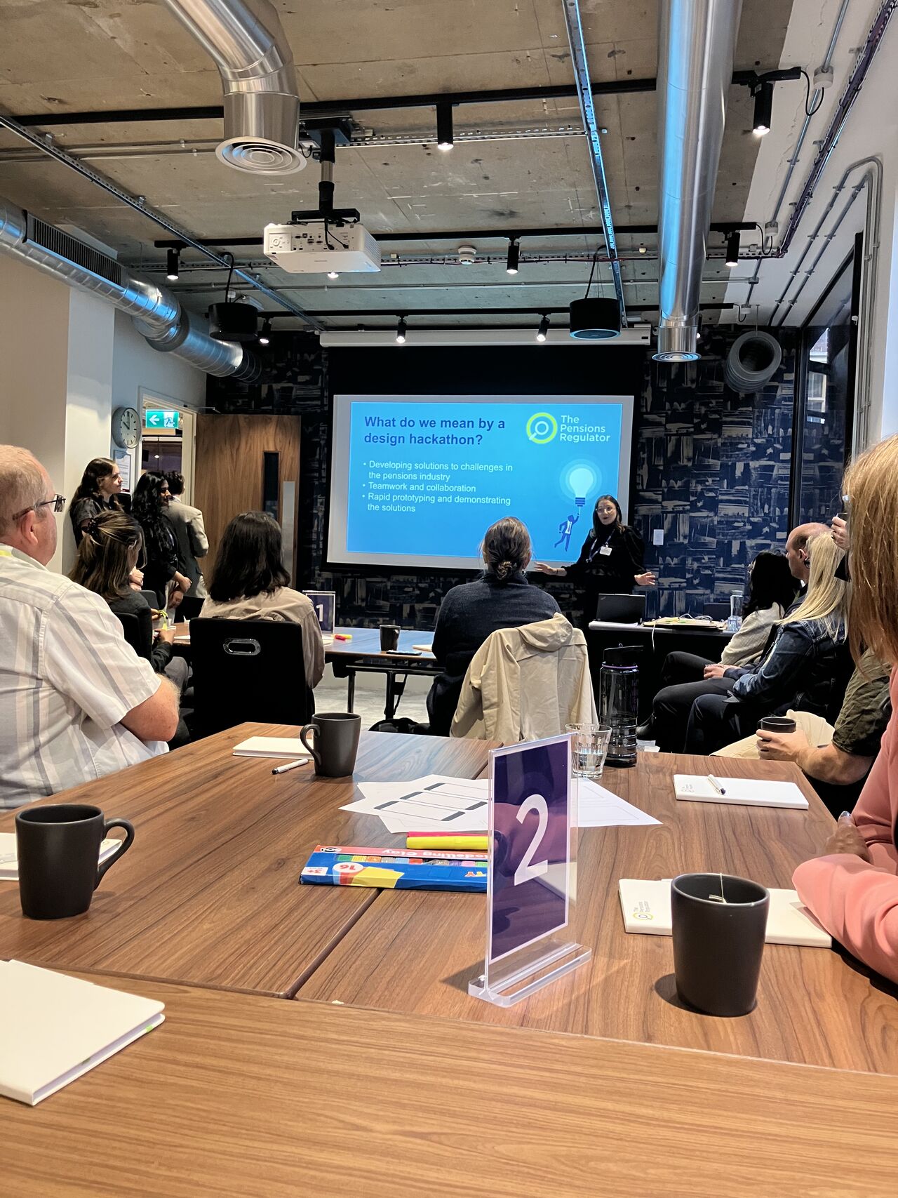 An image of Charlie speaking at the innovation hackathon