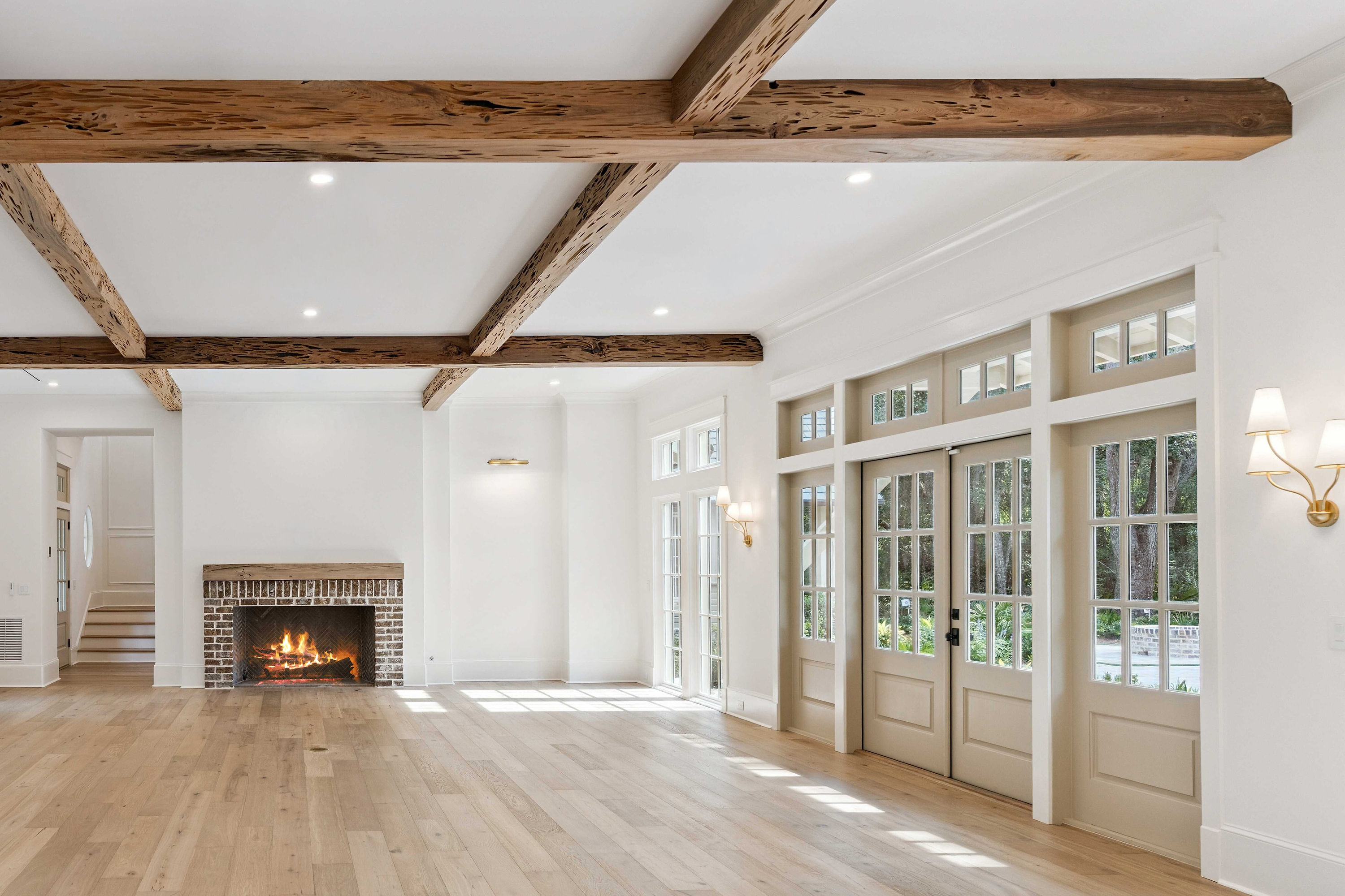 Moss Grove, Flanagan Development, St. Simons Island: great room with brick fireplace and cypress beams
