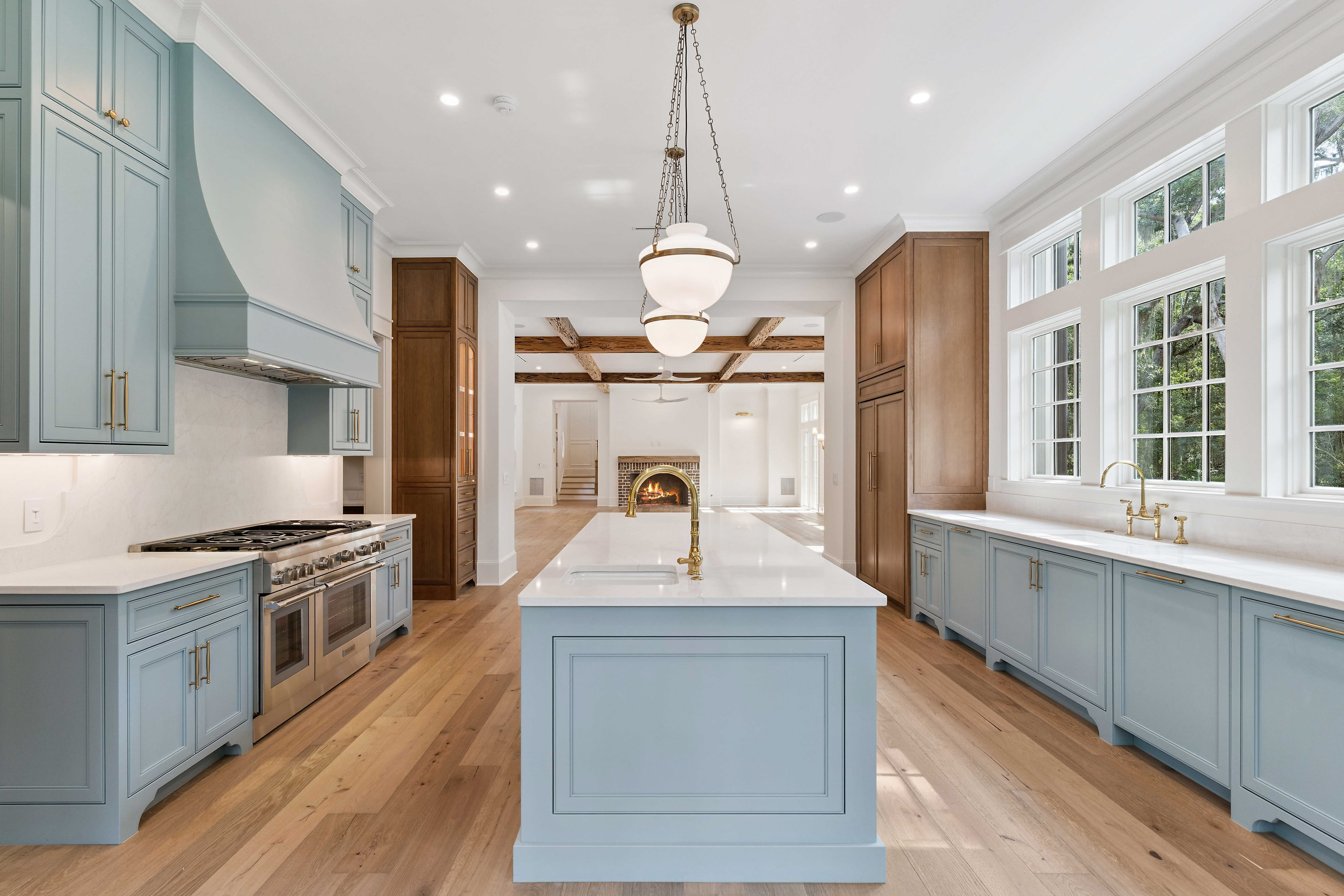Moss Grove, Flanagan Development, St. Simons Island: full kitchen view with blue cabinets and white oak floors