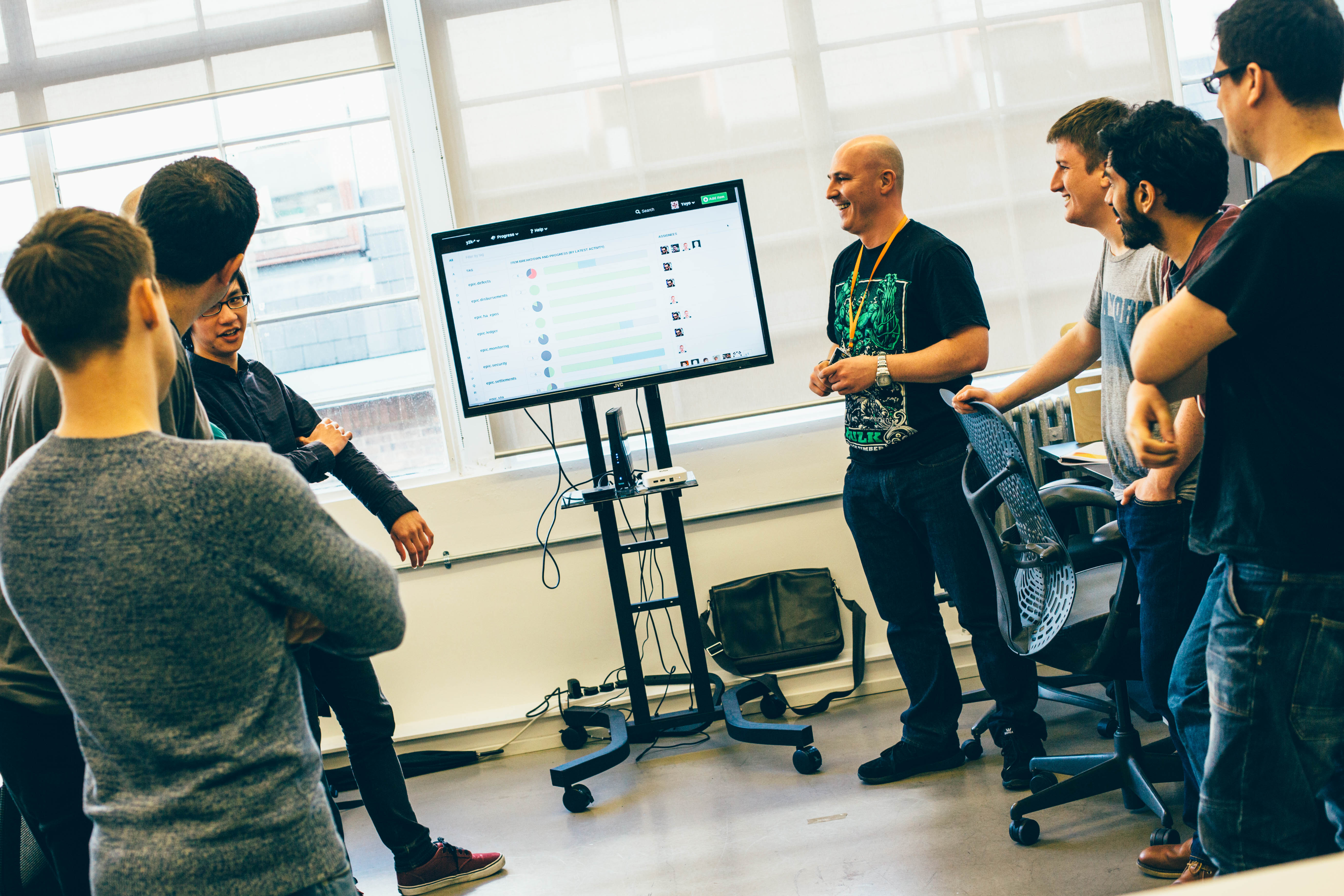 Engineering team collaborating during a standup meeting