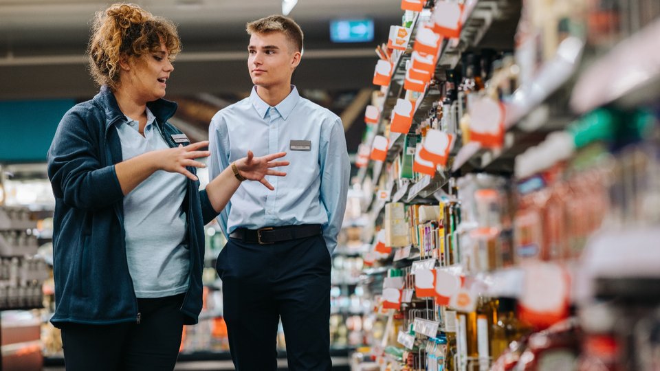 Retail store employees collaborating on the shop floor
