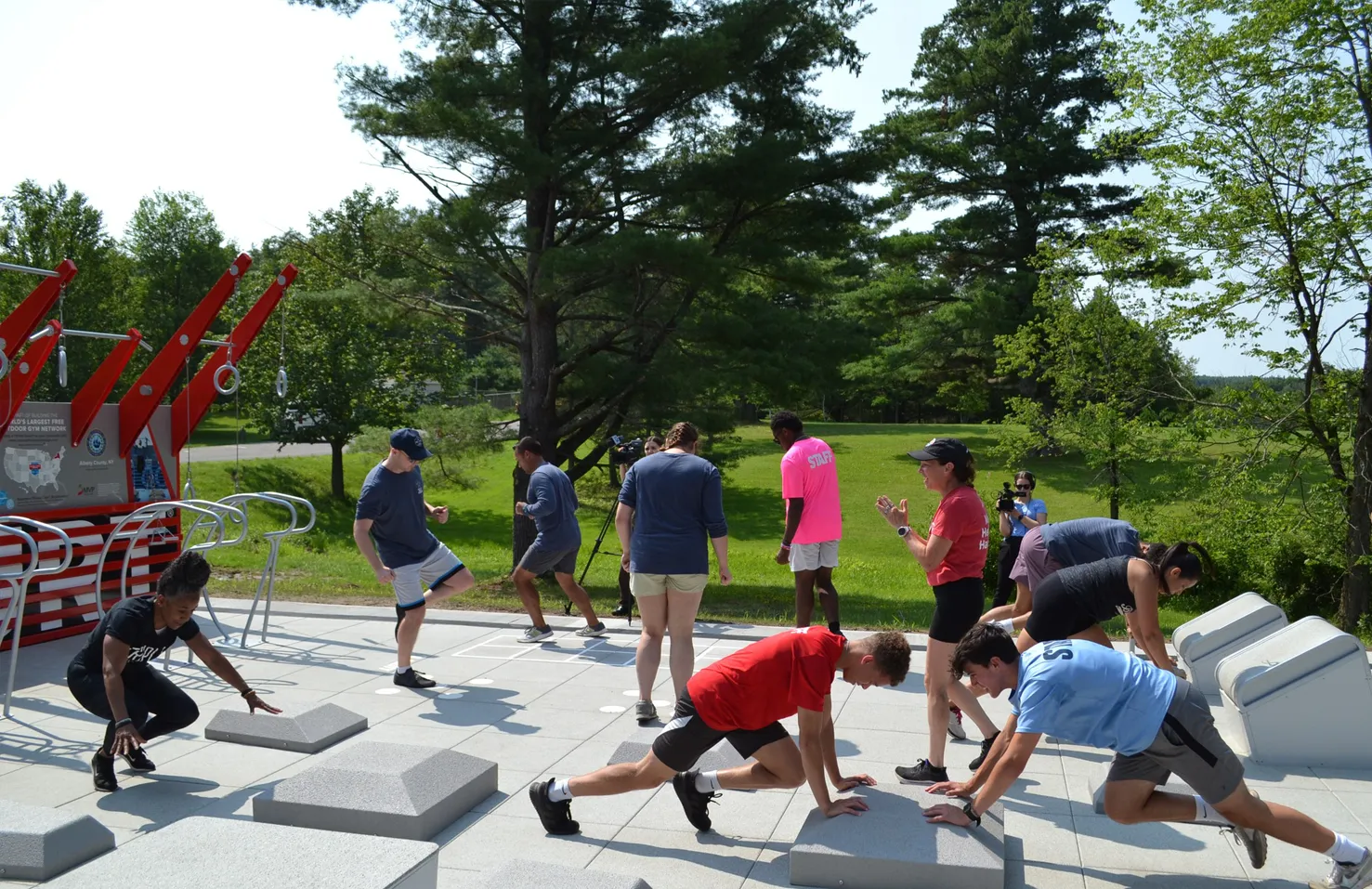 people on Fitness Court working out