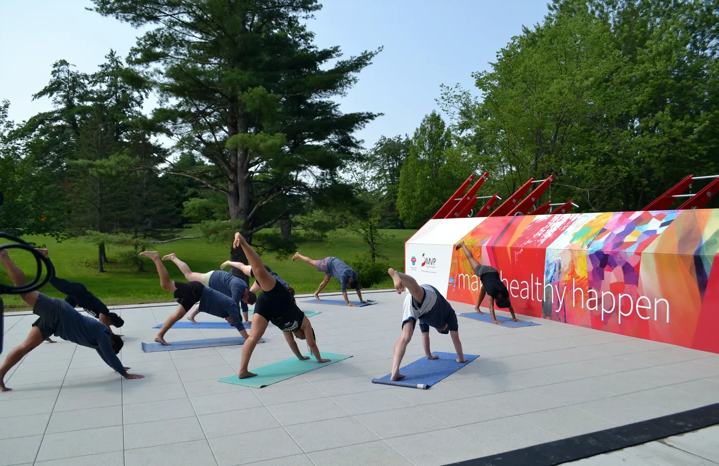 people doing yoga on Fitness Court Studio