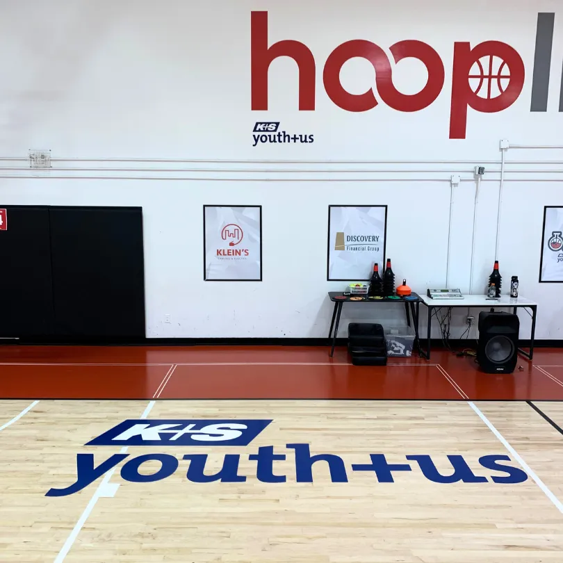 Image of HoopLife Gymnasium with K+S Youth+Us Logo in Gym Floor