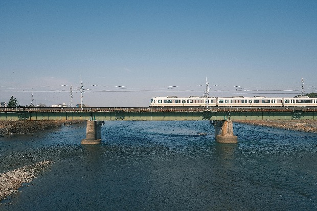 Local train on railway bridge in Japan.