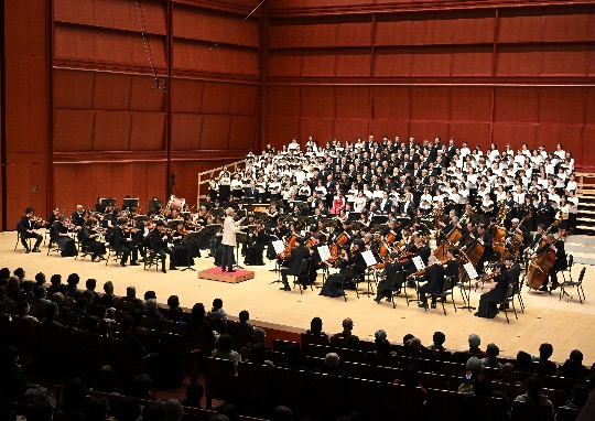 Orchestra and large choir performing Beethoven’s Symphony No. 9 during a December concert in Japan.