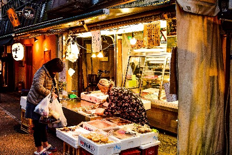 People shopping at a Japanese market in late December as part of New Year preparations.