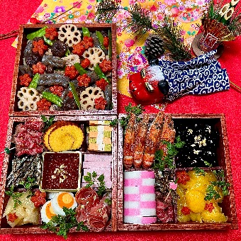 Assorted osechi ryōri arranged in tiered lacquer boxes for New Year’s Day.