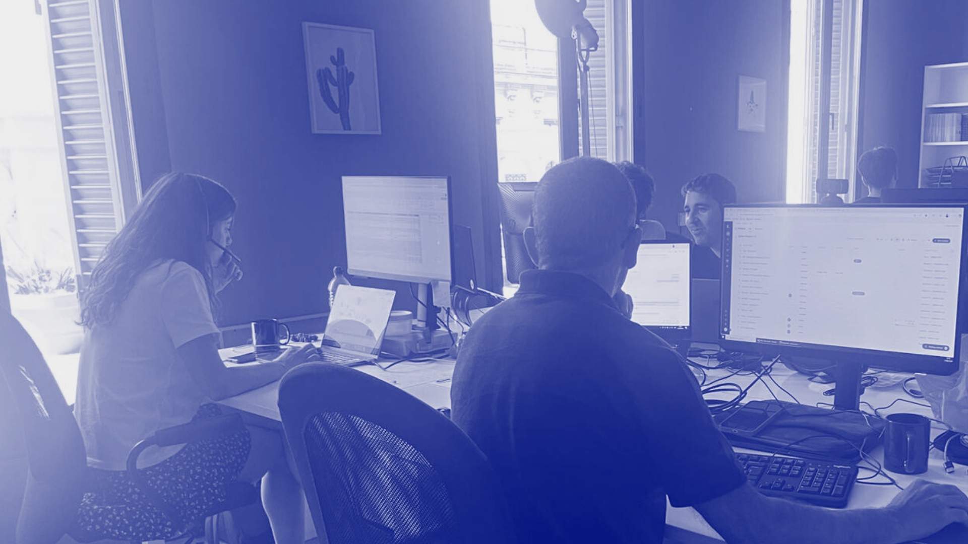 Young people working on LLM and AI projects on an office.