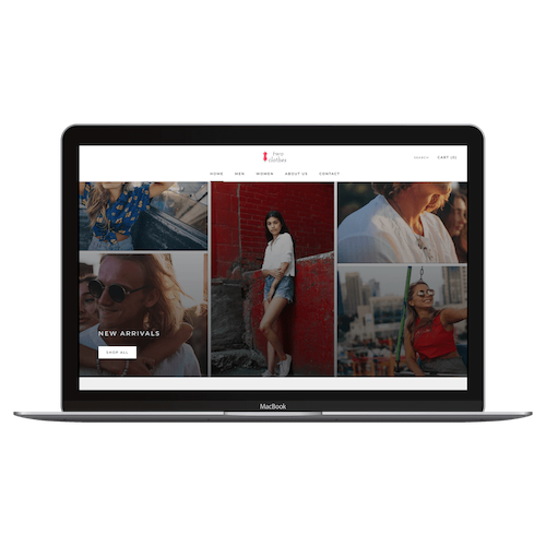 MacBook displaying a fashion website homepage with images of diverse women modeling clothing and a 'New Arrivals' section.
