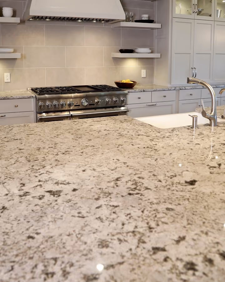 Spacious kitchen with a large Exodus Granite island countertop.
