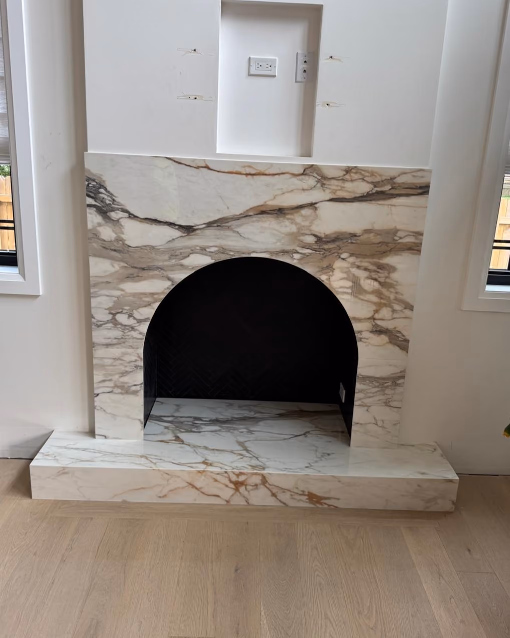 Custom arched fireplace surround and hearth Custom arched fireplace surround and hearth