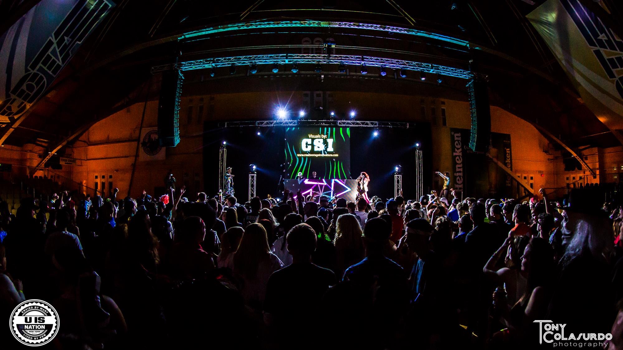 Masquerave was a large‑scale EDM event held at the historic Washington Avenue Armory, bringing together DJs, dancers, and a high‑energy audience for a fully immersive, festival‑style experience. The production combined concert‑level lighting, projection, and atmospheric effects to transform the Armory’s arena into a theatrical, mask‑themed rave environment.