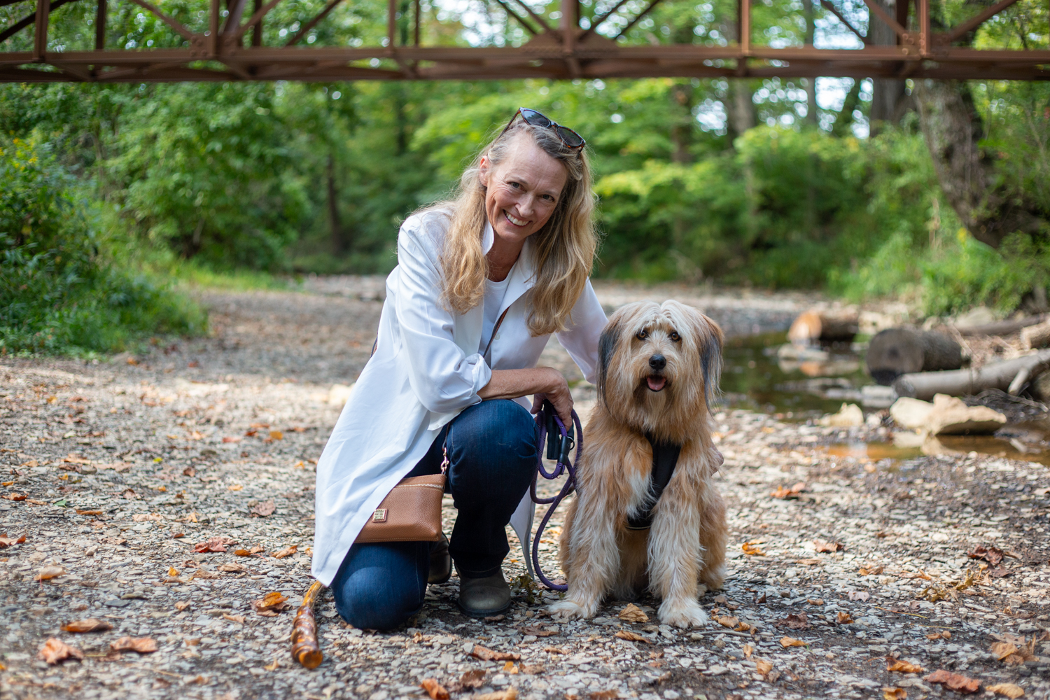 Whitney McKnight, founder of The Edge, taking a break from the Berea beat to walk her dog Esther along the Boone Trace Trail