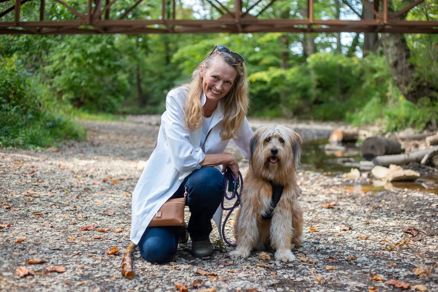 Whitney McKnight, founder of The Edge, taking a break from the Berea beat to walk her dog Esther along the Boone Trace Trail
