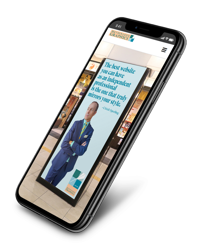 mockup of iphone showing website of Meticulous Graphics