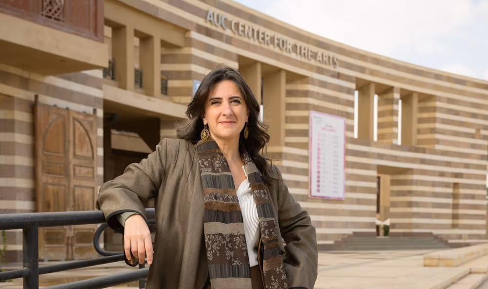 Student, Yasmin, looking into a microscope
