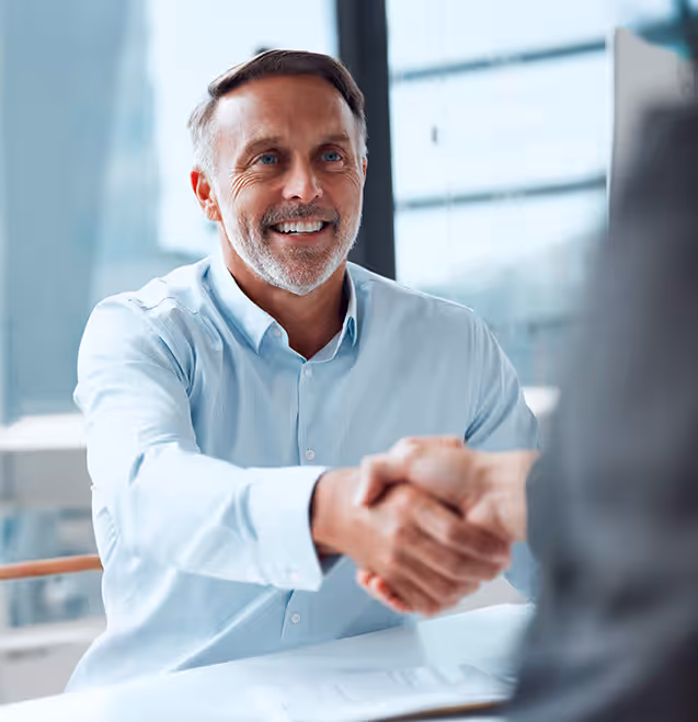 man shaking hands with another person