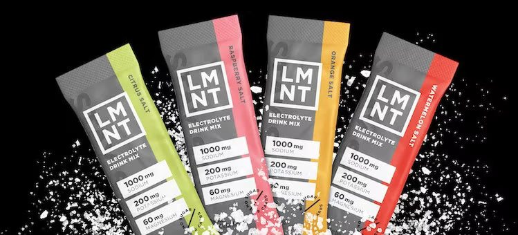 Assorted LMNT electrolyte drink mix stick packs featuring citrus, raspberry, orange, and watermelon salt flavors displayed with salt crystals | Steuart Nutrition