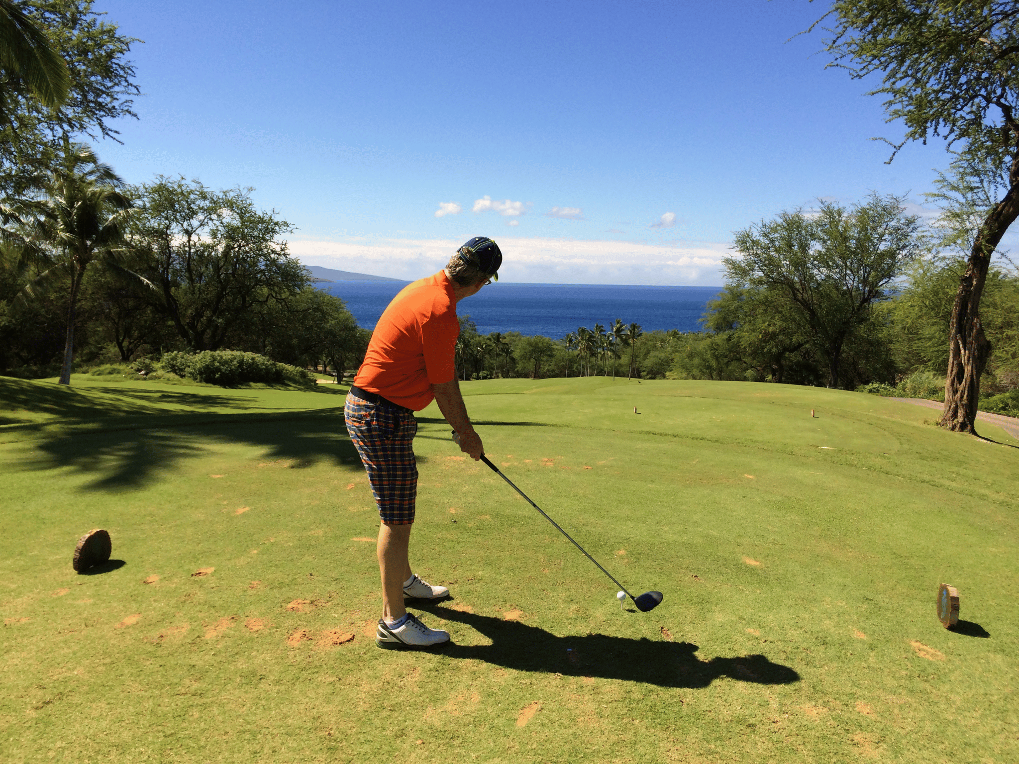 Barry setting up in golf posture with driver