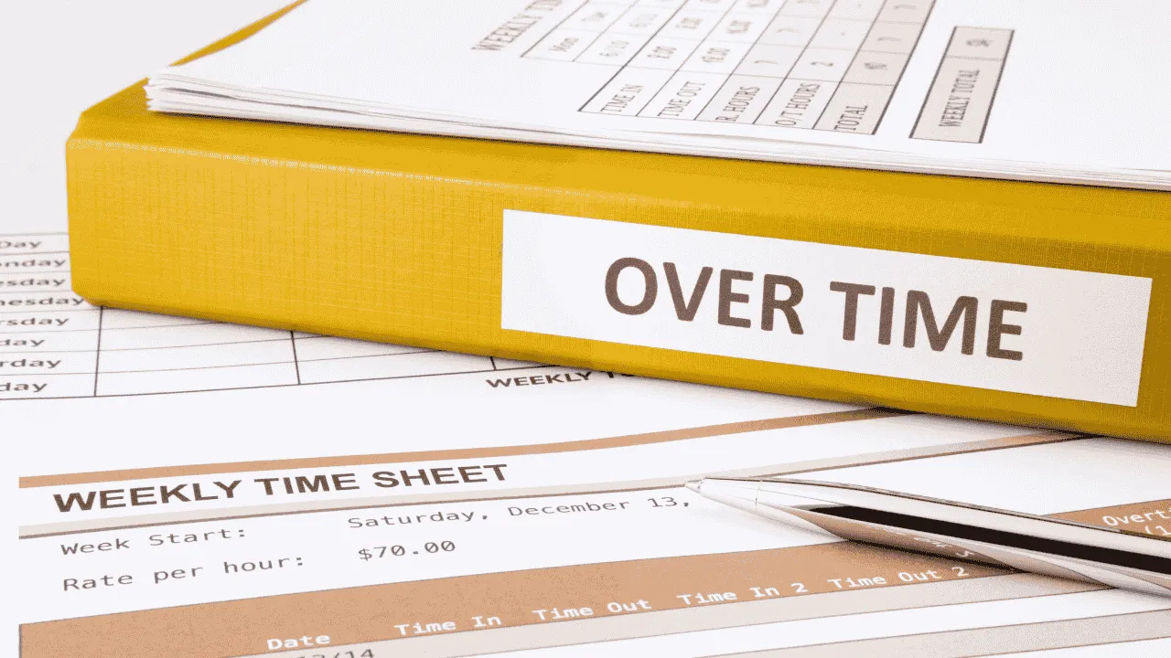 A binder with a label reading "overtime"