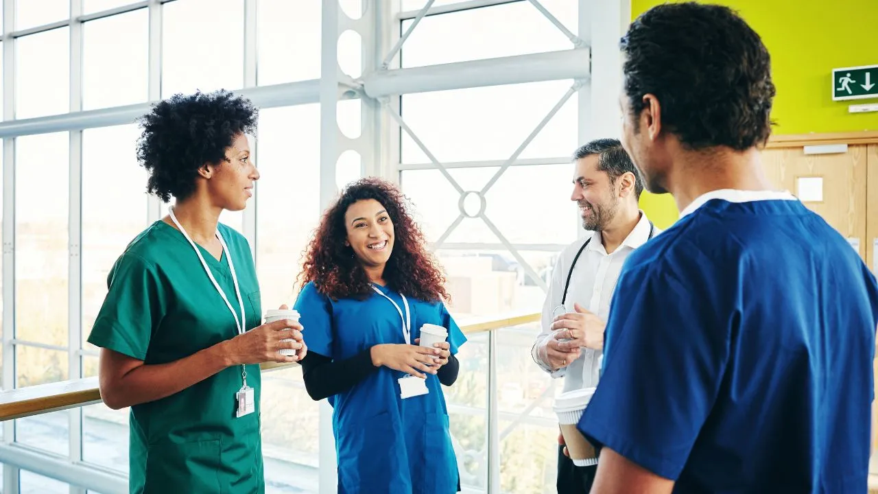 A group of nursing professionals engaged in conversation