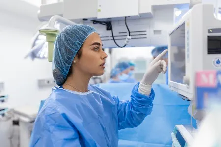ER nurse taking care of a patient and monitoring vitals
