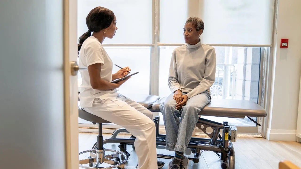 A clinician administering a BIMS assessment