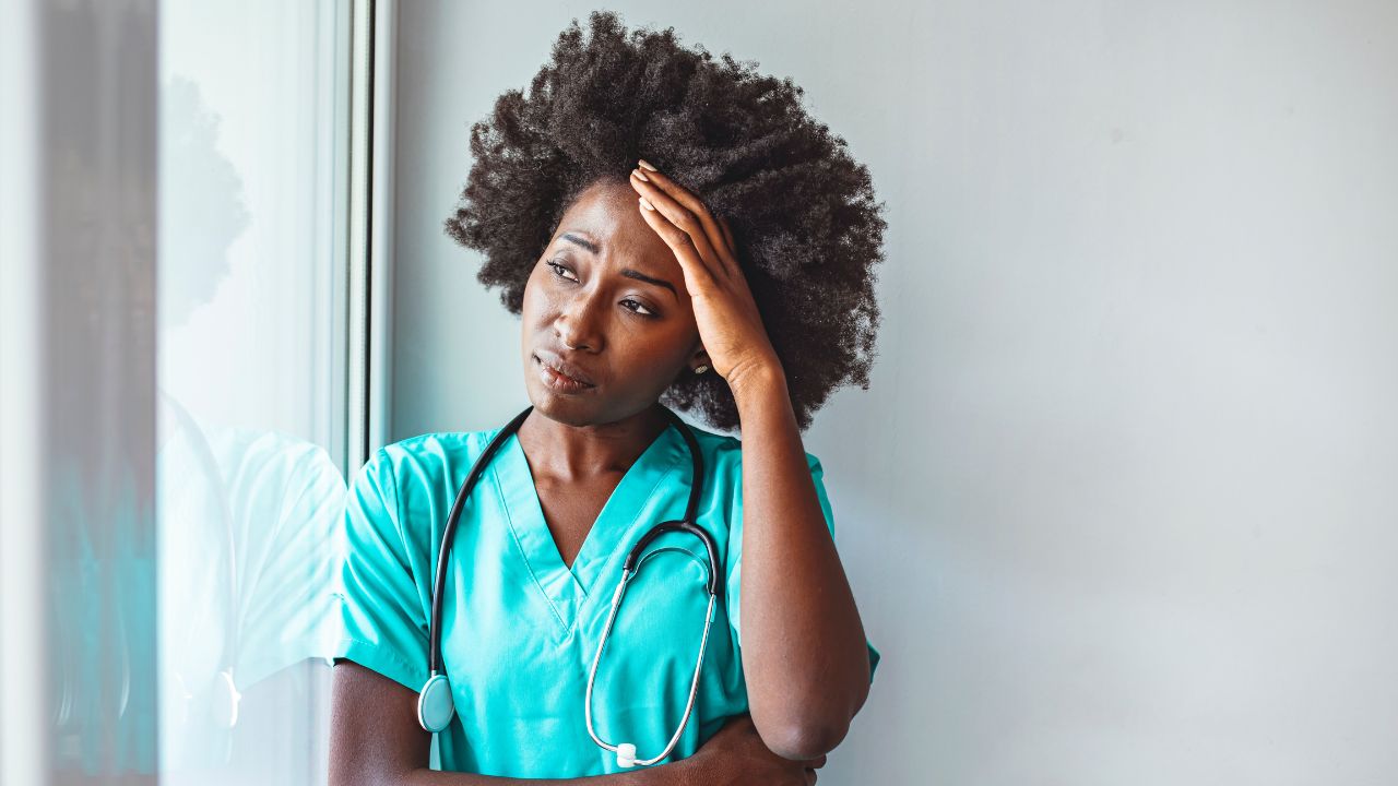 a nurse looking tired or distressed