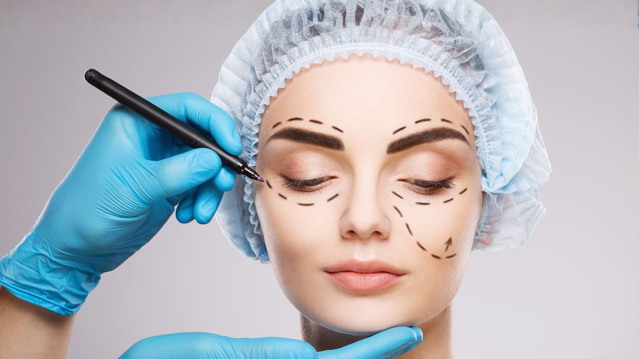 plastic surgeon drawing surgical lines on a woman's face