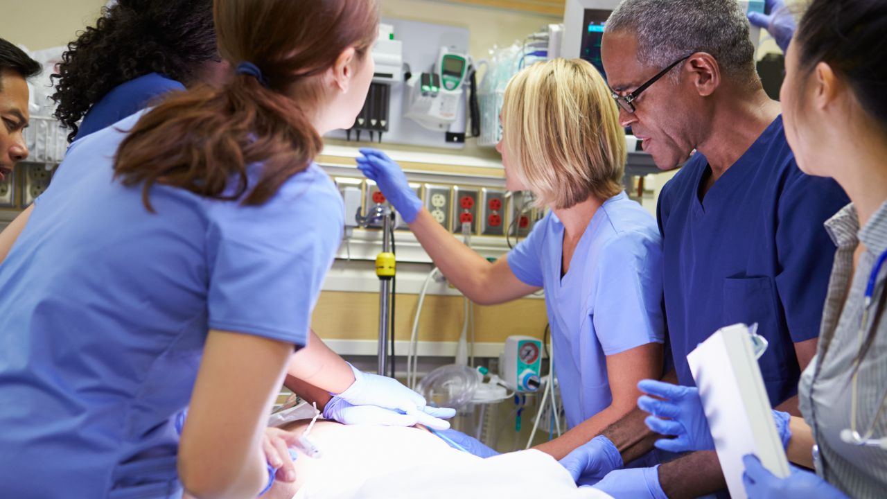 nurses working on a patient in a level 4 trauma center