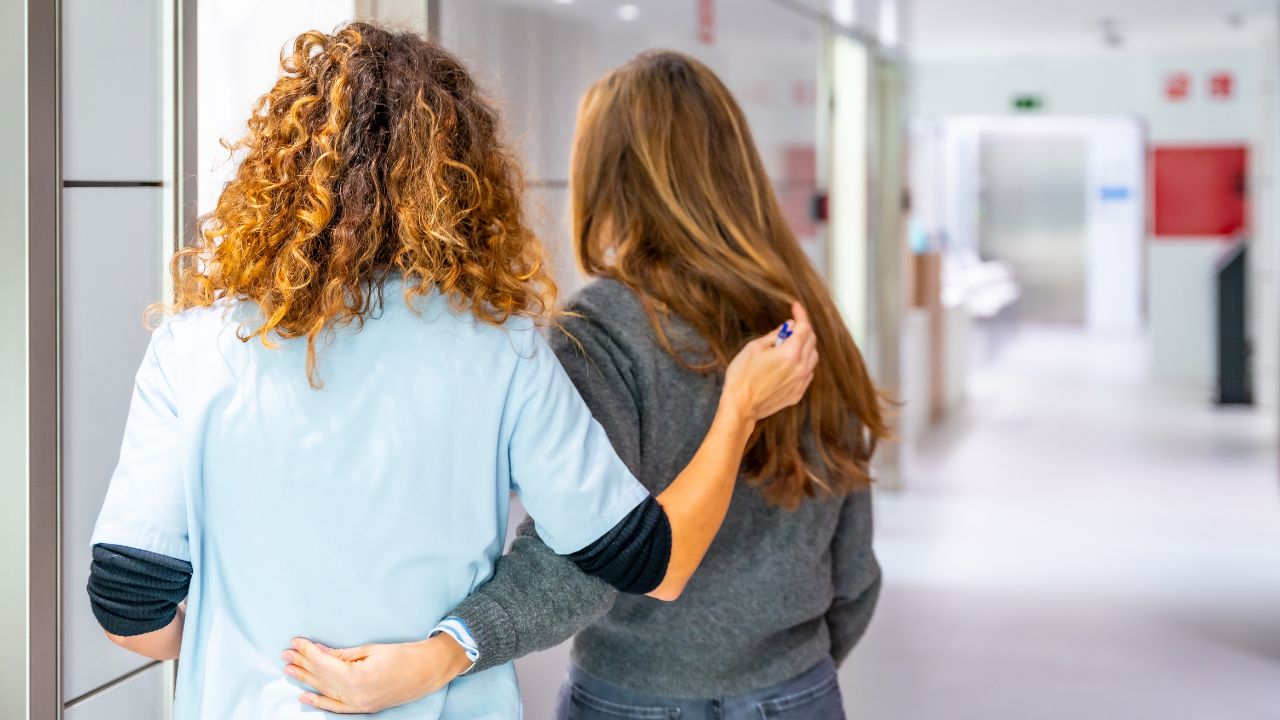 Two nurses hugging each other