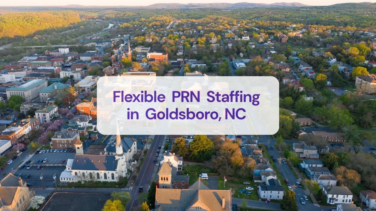 a view of the city with houses and trees