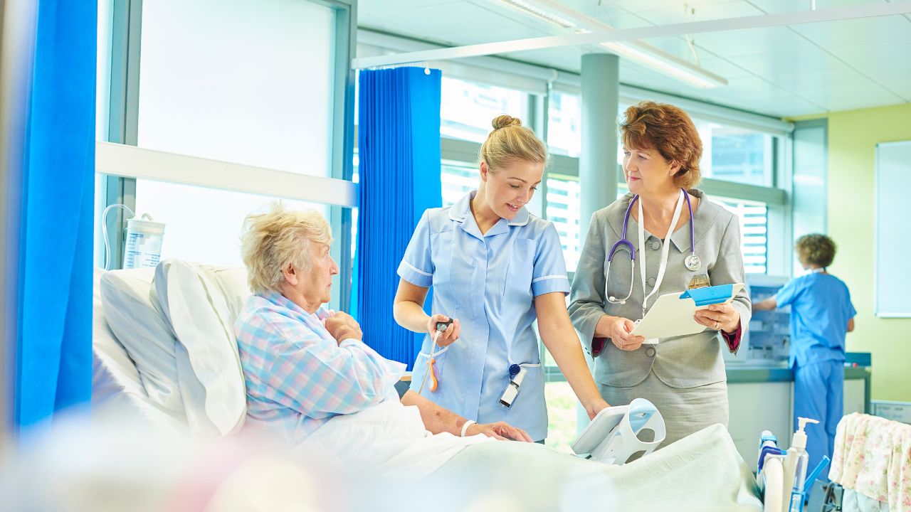 image of patient in post acute care with two nurses next to her