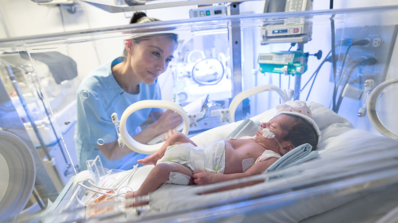 a nurse take caring of baby