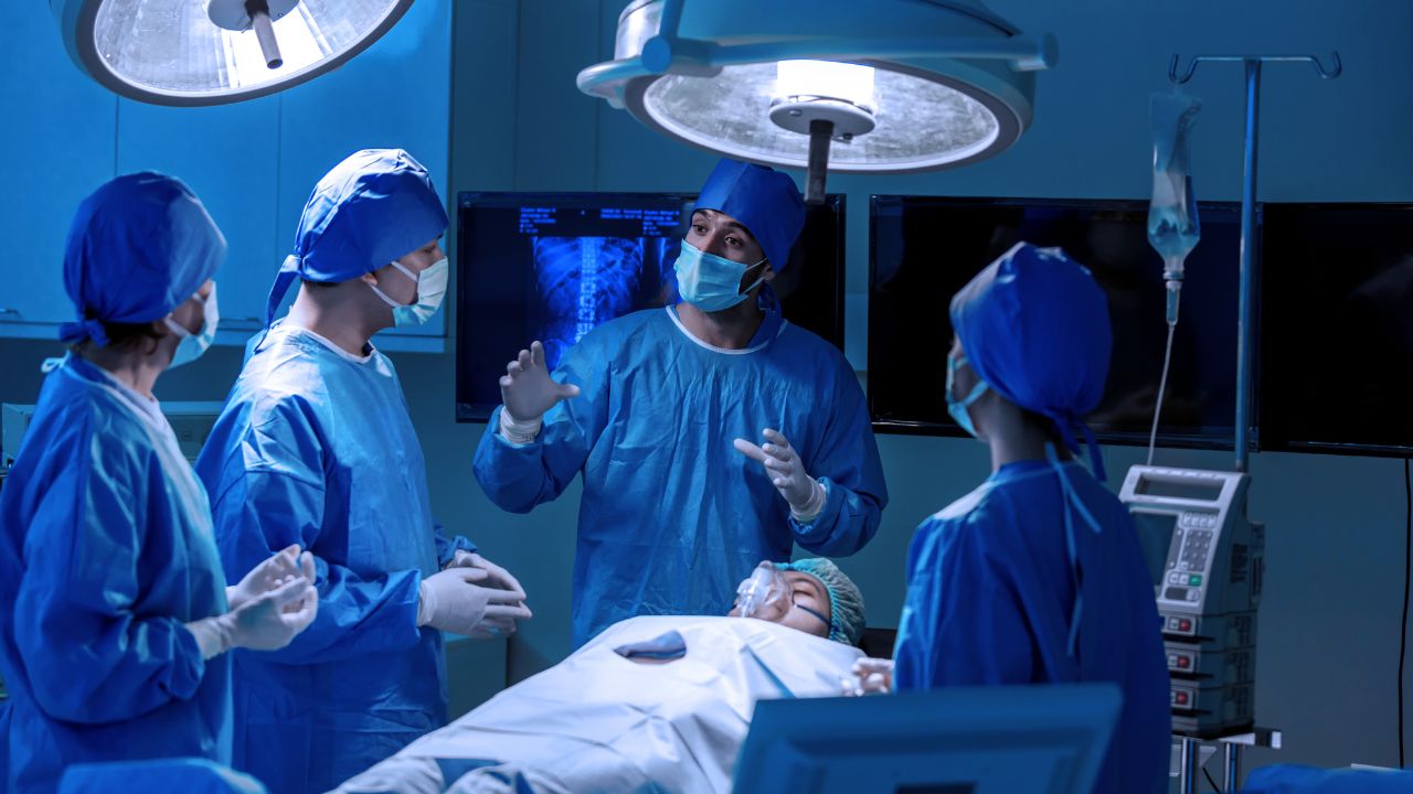 nurses and a doctor before one surgery