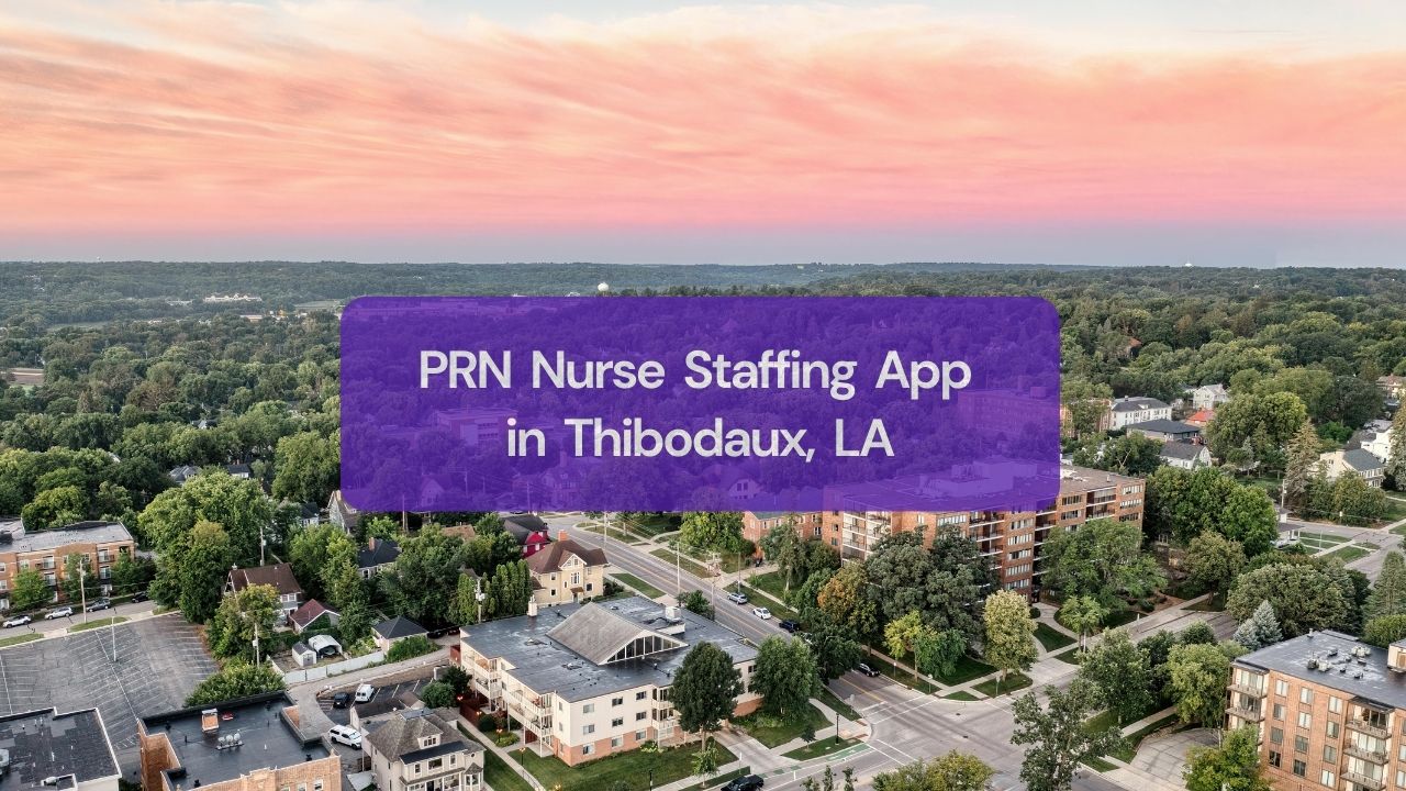 a view of the city with houses and trees