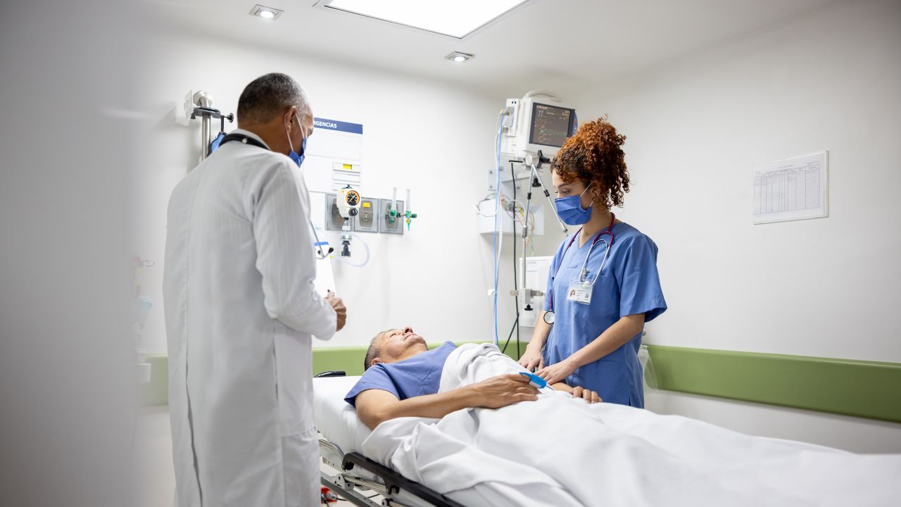 Nurse with small graduation cap in their hands