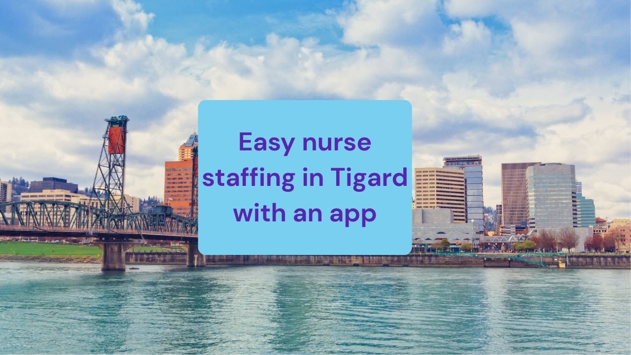 a bridge crossing over water to land with highrise city buildings