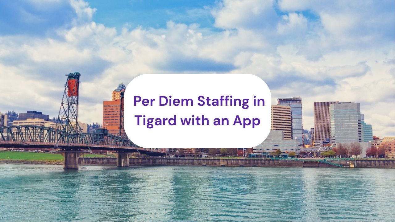 a bridge crossing over water to land with highrise city buildings