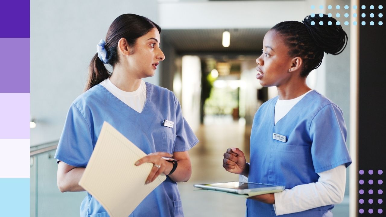 Two nurses speaking to each other