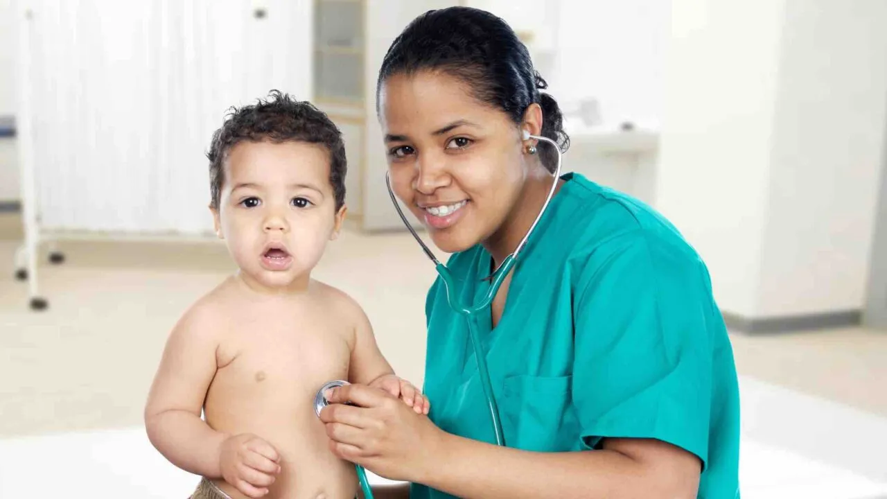 Peiatrician working with a baby