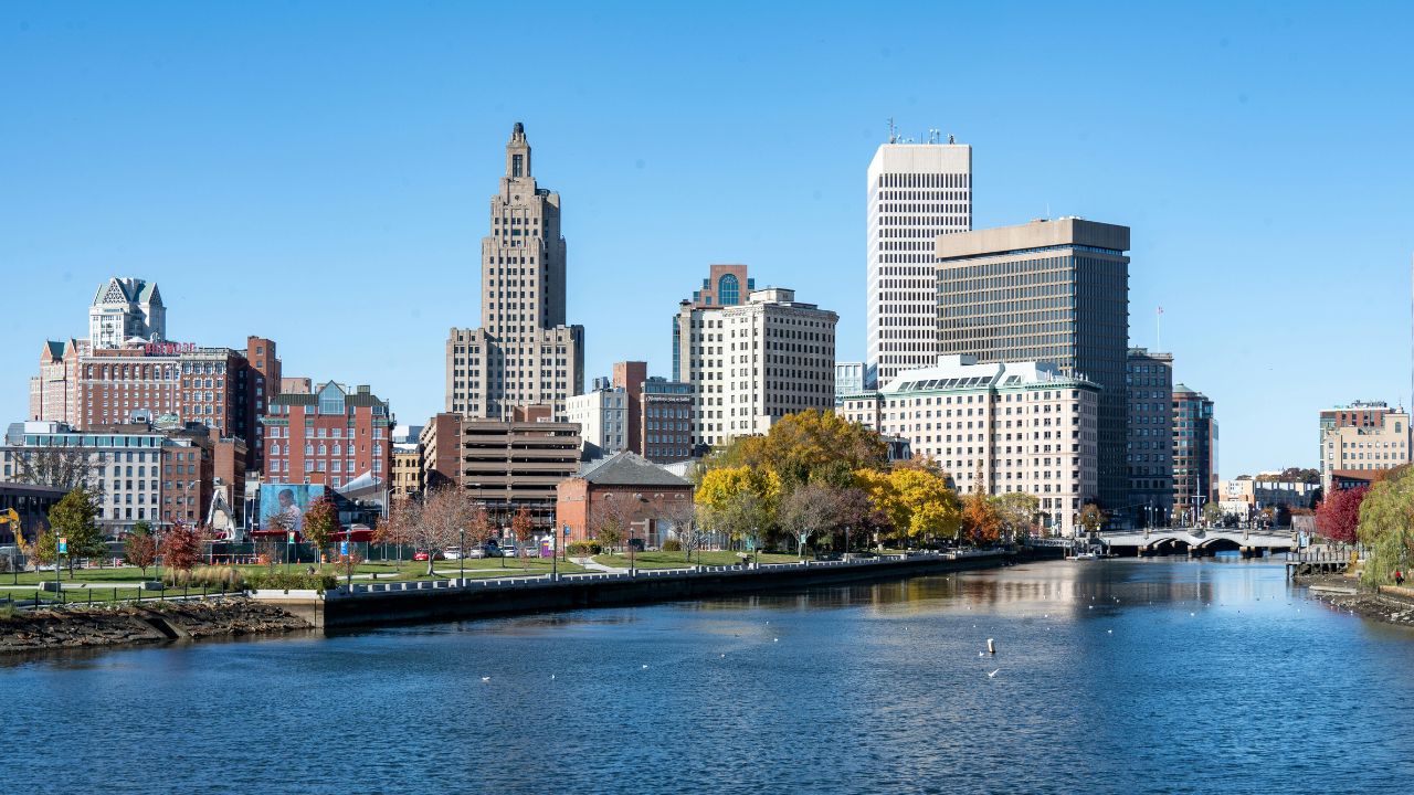 a view of the city, buildings around and the coast