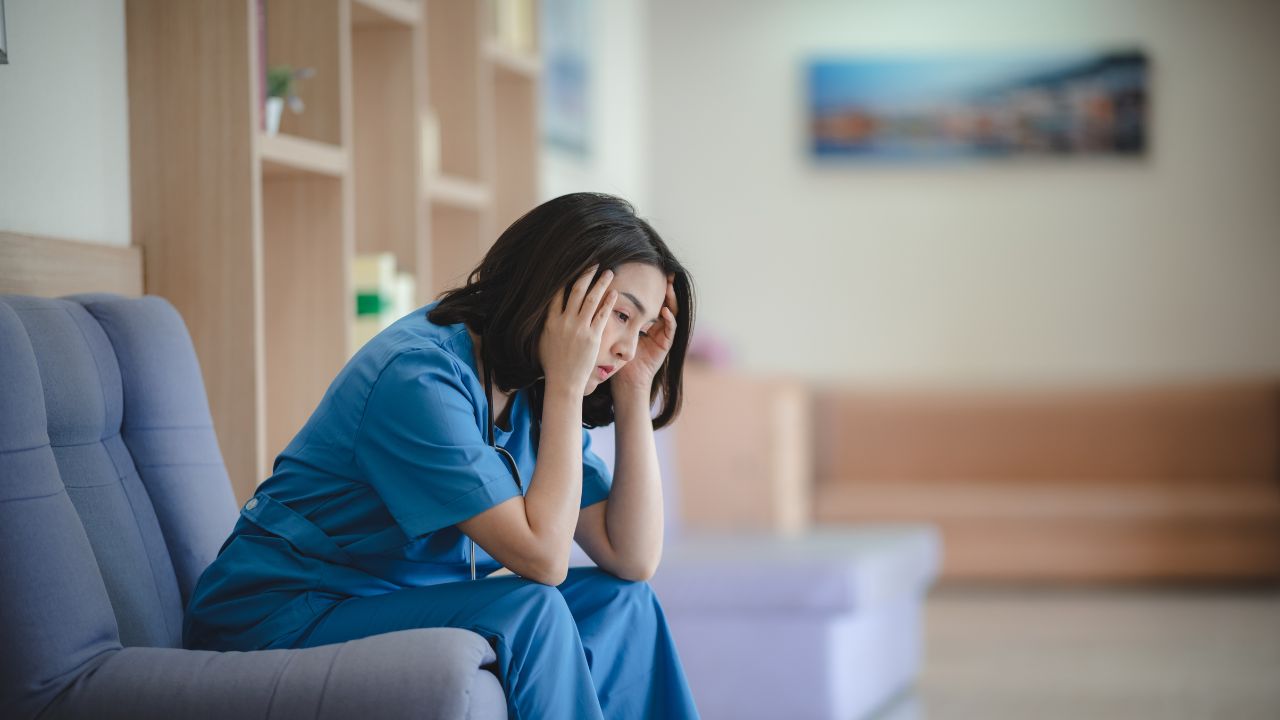 A picture of a stressed nurse