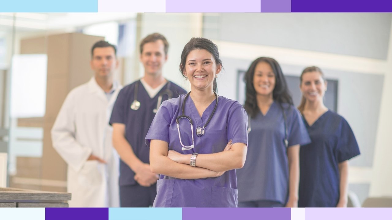 A team of nurses and healthcare professionals standing together and smiling