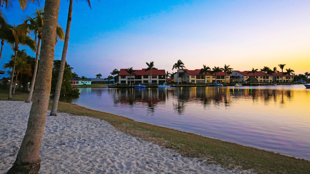 a picture of houses next to a beach