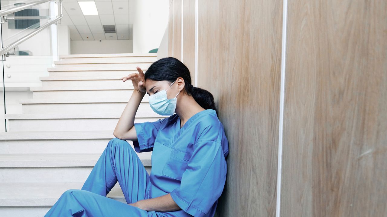 Tired Nurse on the Floor