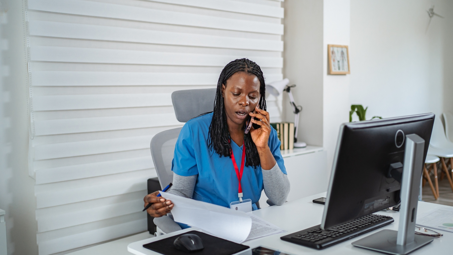 A nurse at a desk